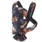 Floral print BabyBjörn Carrier One Cotton baby carrier front view featuring soft cotton fabric, ergonomic seat, and secure buckles for safe babywearing from birth.