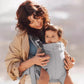 Mother and baby enjoying outdoor time together using BabyBjörn Harmony Carrier Mesh – breathable mesh keeps both cool and close during walks or errands