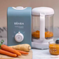 Beaba Babycook Express in action, steaming and blending fresh carrots into smooth baby puree—demonstrating fast, easy, and nutritious homemade baby food preparation.