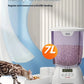 A Bengal cat eating from the Cat Mate 7L automatic feeder in a clean, modern living space. The feeder provides regular, measured meals for healthy pet nutrition.