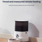 White and black Dogness F10 4L automatic pet feeder dispensing dry food into bowl on hardwood floor, app-controlled scheduling for cats and dogs.