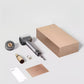 The complete Dreame Hair Glory Mix set unboxed, showing the space grey hair dryer, a magnetic styling nozzle, a hair essence bottle, and its sleek, minimalist packaging