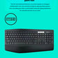 Close-up of the MK850 keyboard against a bright teal background, highlighting the generously padded wrist rest and quiet, well-spaced keys.