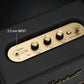  Close-up of the Marshall Stanmore III’s brass-finished control panel featuring 3.5 mm aux input, volume, bass, and treble knobs for precise sound tuning.