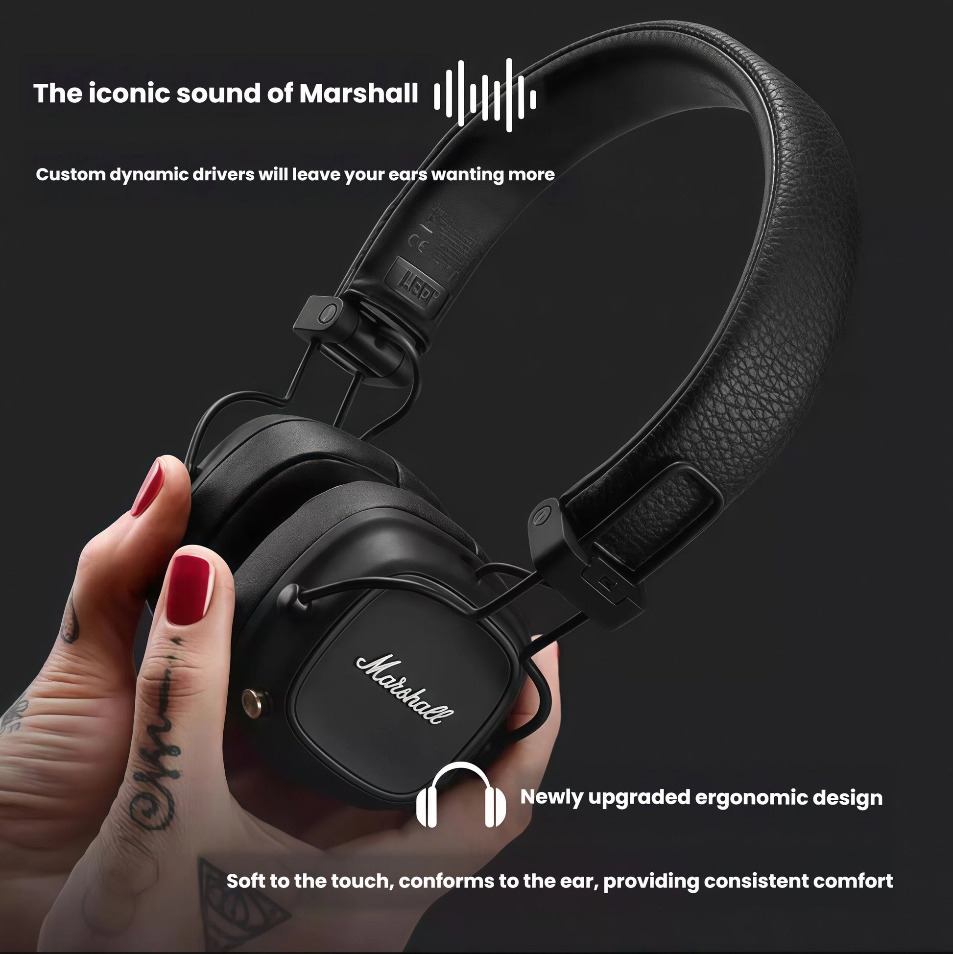 Close-up of a hand holding Marshall Major IV headphones, emphasizing soft-touch earcups that conform to the ear, upgraded ergonomic design, and premium comfort for extended wear.
