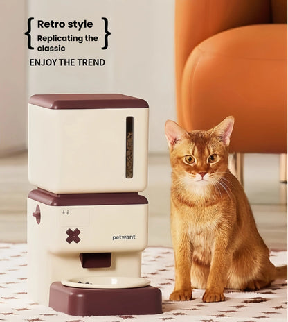 Petwant retro feeder beside a cat