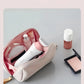 Philips Lady Shaver BRL146 stored in a makeup bag, highlighting its small, lightweight, and portable design.