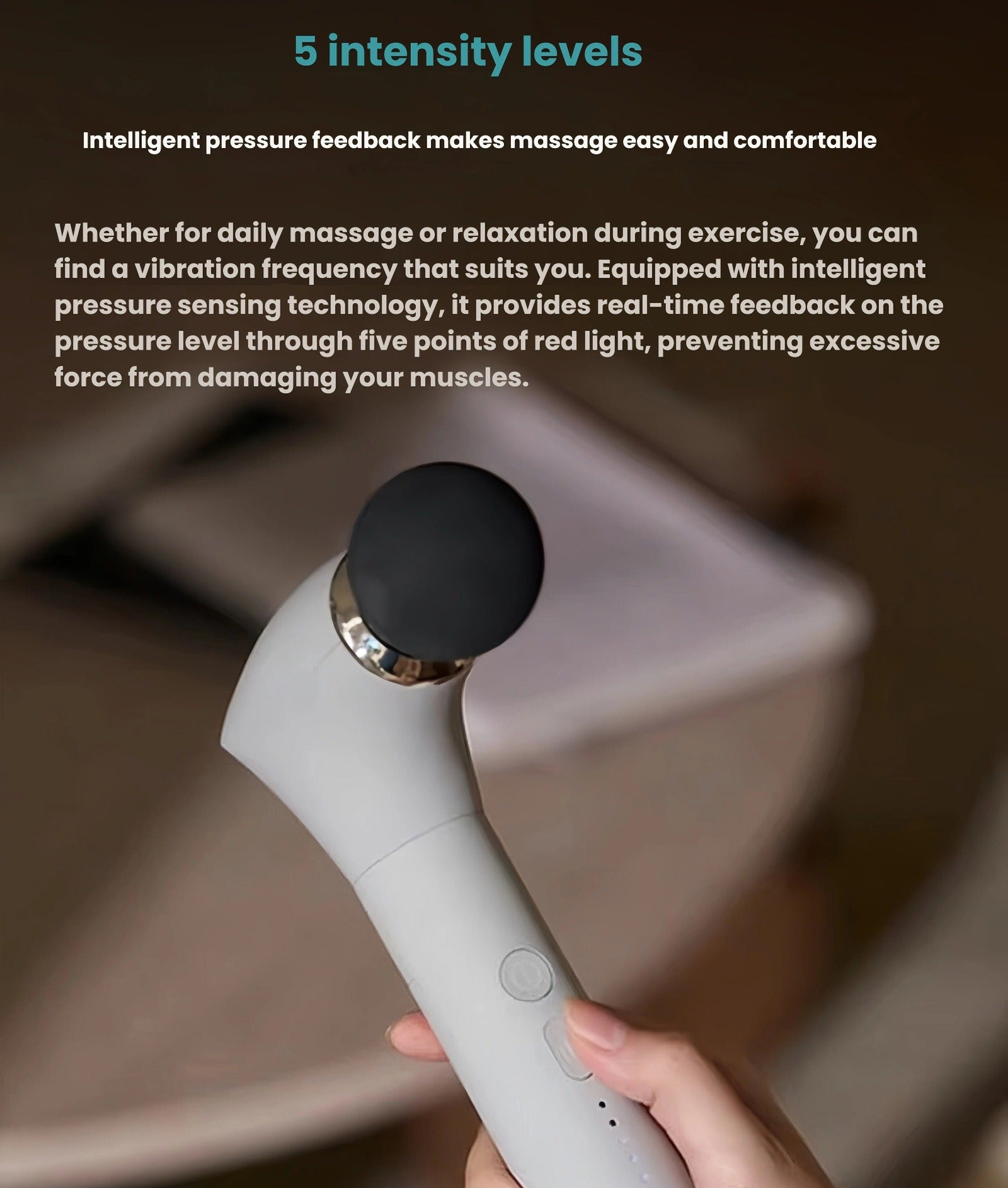 Close-up of the Philips massage gun being held in hand, showing the control buttons and red light indicators. Offers 5 intensity levels with real-time pressure feedback to prevent muscle damage.