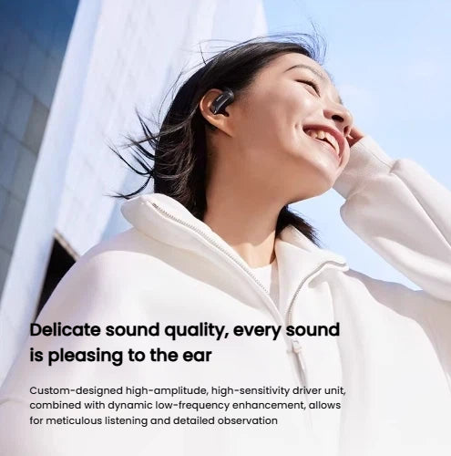 Smiling woman enjoying premium audio from Shokz OpenFit Air wireless earbuds, featuring high-amplitude, high-sensitivity driver unit for clear, detailed sound.