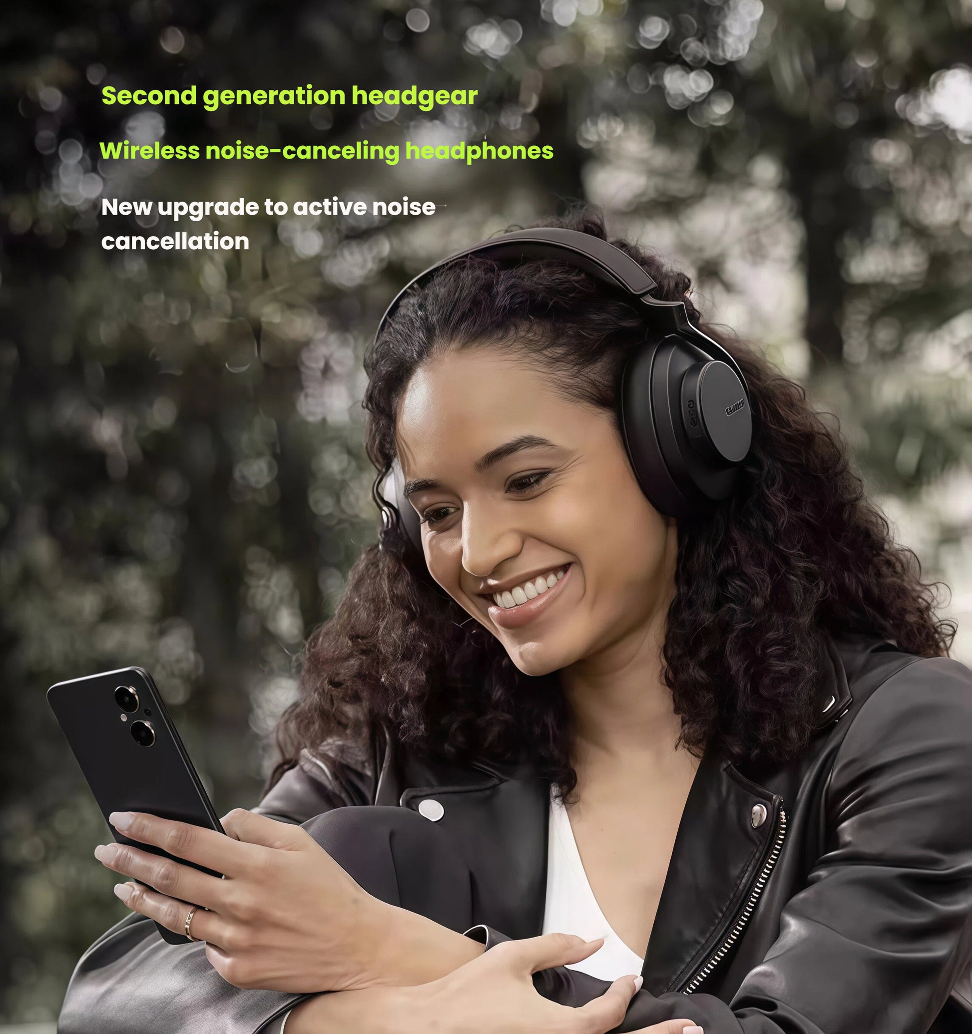 Woman smiling while using Shure AONIC 50 Gen2 wireless noise-canceling over-ear headphones outdoors, showcasing advanced active noise cancellation and premium design for on-the-go listening.